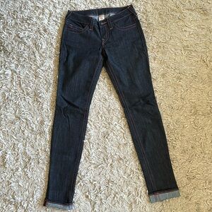 True Religion size 27 dark wash jeans with pink stitching